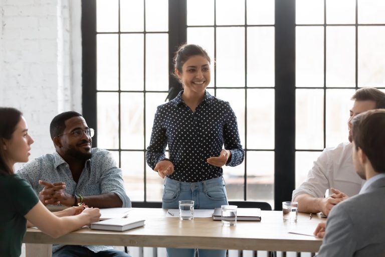 Happy Indian business leader holding corporate meeting with diverse team of employees. Mentor training group of interns. Coach teaching new hired employees. Young female boss instructing staff SSUCv3H4sIAAAAAAAACpxTSW7kMAy8DzB/aOgcAtqXfGUwBy10txC3HdhygiDI3yOvcc9xLoJYJItkSfz8/etyIcGPOZLny+dsVTu37TSWwZfcdxWmTxs+YJdwOCNvg9D0DGDKpR+yb89g8CXeOn/HCnZT287w1+IkY/FlGnGcq29Q9AWvlWMFD4q1xT+rfdkdi7NmVBchTydsnMKC7dBK/l+Z6+XvPo2/Yhc/fnqrUBrQ38eSlwmPFqvDqAdqxvmDbdxRZaefC7T+/vEP0UOaDtwpkQxwazlIqhwEKhwkblyygjER0g/xelmm2BQesEW/ir7VII1UhiJFoExjpWQUPNMMUDtmpGMuhKN1or0N0jKEJGgEGYUBbwSHxhmpZoLg4xGsjLDOyQjJIgVpUmVOyYFFK2RAa4NgRzAPKdCGOZDVVY+UwAcVQUtkiiNXSeMRHLRWTEUJMTgDklkEq6kDHqRIVlnbcL/IsGpLXt4LDvfzV/NTyv3pl7310bdzgDip9TrkmLvrKa0vt2UN9rTYT10Z5ic73om0ff/qQzt/iKZy4o7f/DjW8LTjp0KxLl1/P9Xp+rI80sZKUt2M2WSCa0GNcUJyzRRVZgtYt+mWK8/Szk5U7fiS03n0PHdALHcGm4iATlUJG0MhRONBsSphE12jhKwSfn0DAAD//wMA/UEWsCgEAAA=